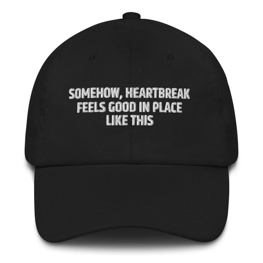 Somehow Heartbreak Feels Good In A Place Like This  hat