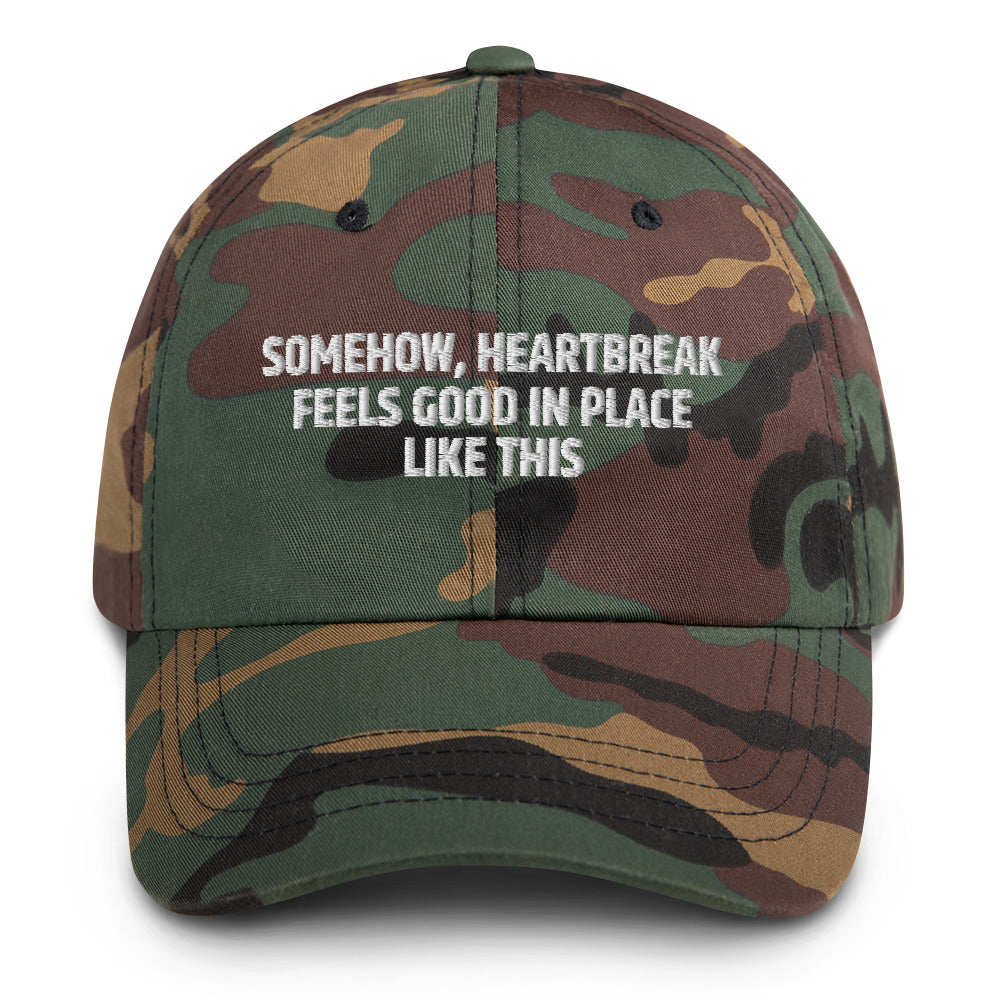 Somehow Heartbreak Feels Good In A Place Like This  hat