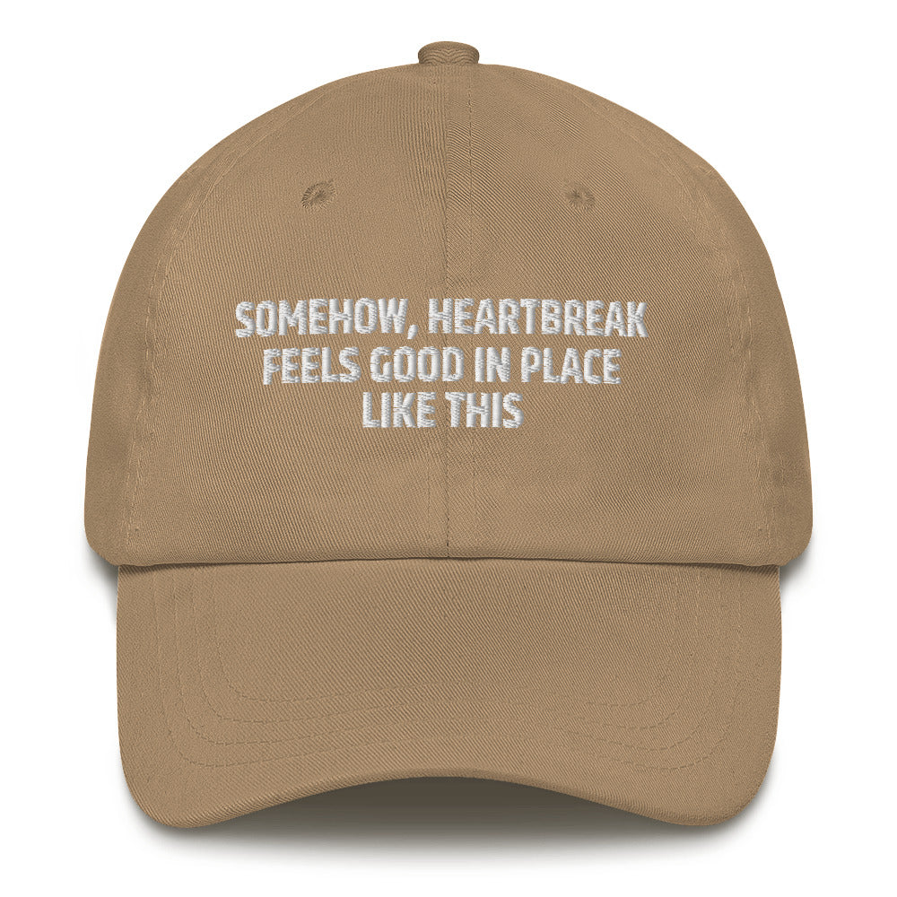 Somehow Heartbreak Feels Good In A Place Like This  hat