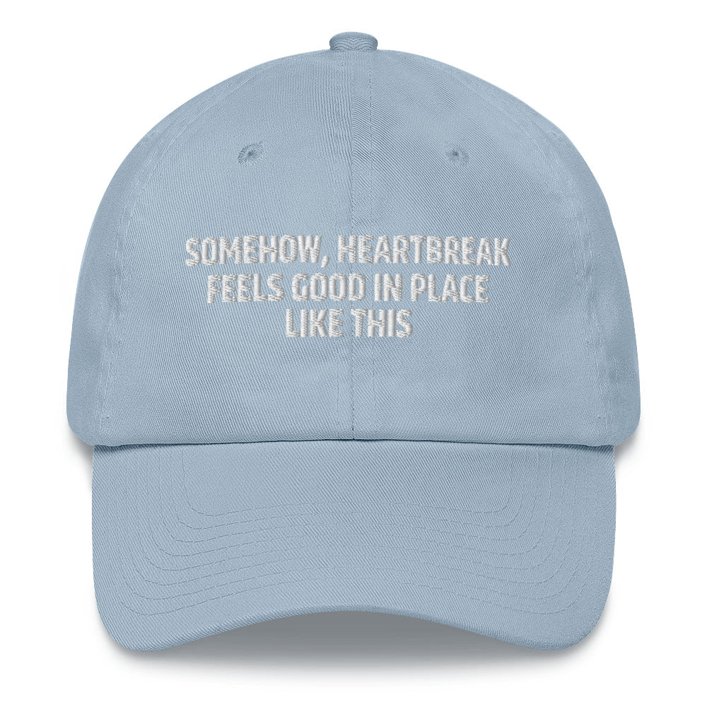 Somehow Heartbreak Feels Good In A Place Like This  hat