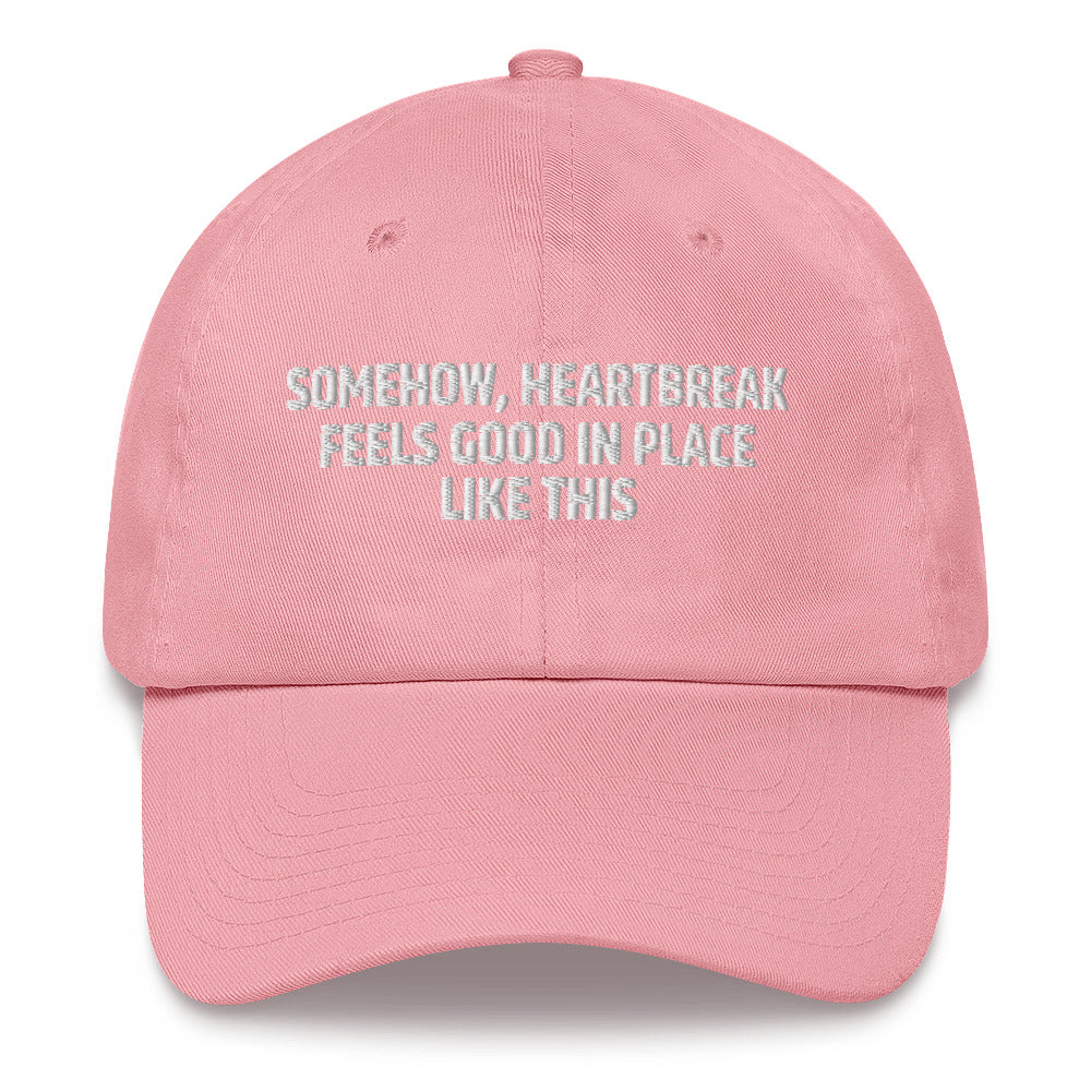 Somehow Heartbreak Feels Good In A Place Like This  hat