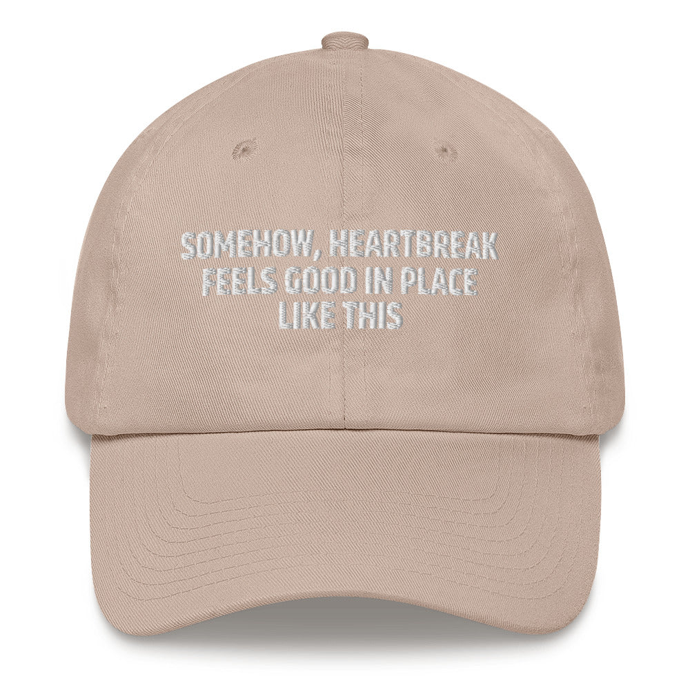 Somehow Heartbreak Feels Good In A Place Like This  hat